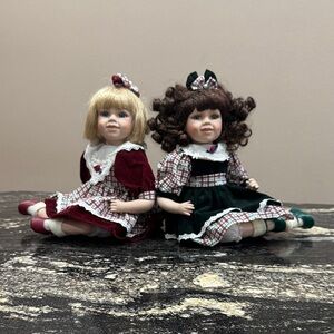 Set of Two Girls' Porcelain Dolls in Burgundy and Forest Green Dresses
